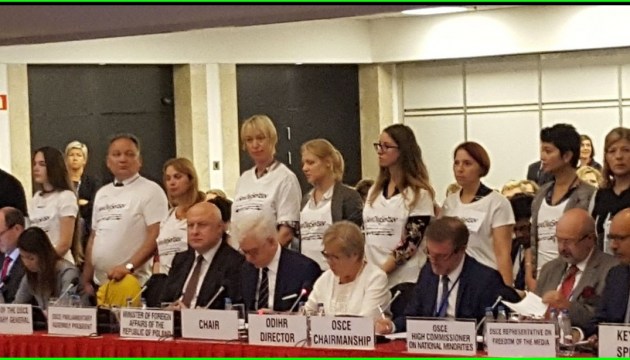 Activists attend OSCE meeting wearing T-shirts with slogan #SaveOlegSentsov. Photos