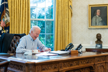 Biden signs defense budget with $800M in aid for Ukraine