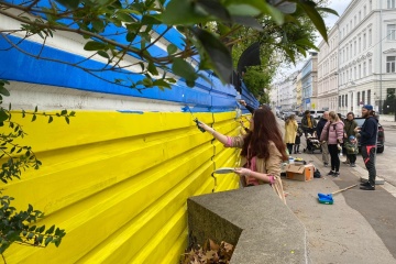 In Vienna, fence outside Russian embassy painted in colors of Ukrainian flag