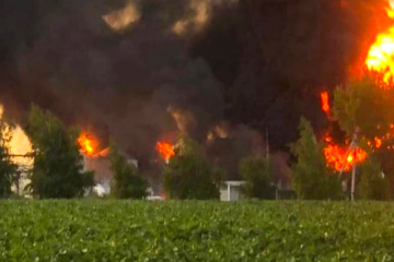 50 rescuers extinguishing fire caused by Russian missile attack on oil depot