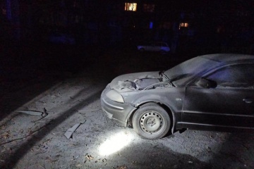 Fragments of destroyed missile damaged car in Kyiv center