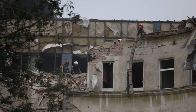 Rescuers in Lviv clear rubble from apartments where two people may be trapped