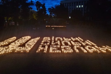 Lit candles laid out in shape of Ukraine’s Coat of Arms in Dnipro