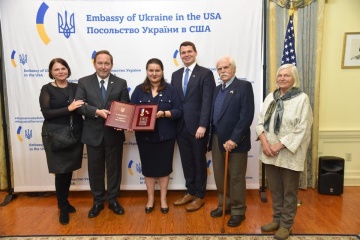 Ambassador Markarova hands Hero of Ukraine award to son of Prof. Kindzelsky who saved Chornobyl victims
