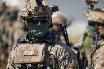 During settlement clearing, SOF soldiers eliminated enemy personnel and captured documents