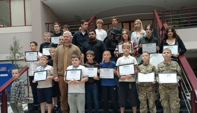 Children honored in Kyiv for helping clear rubble after Russian attack Children honored in Kyiv for helping clear rubble after Russian attack