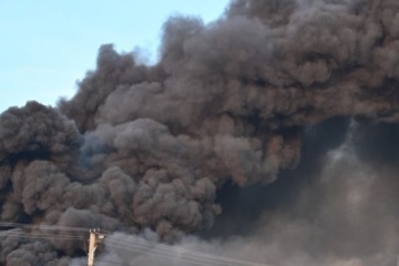 Russian drone strike sets trucks ablaze in Kyiv region