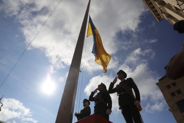 Ukrainian flag solemnly raised near city hall in Kyiv