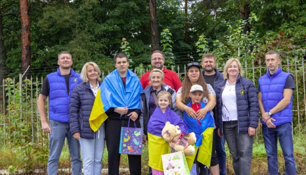 Three children and young man return from Russia to Ukraine