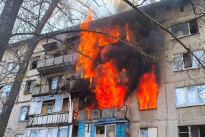 Russian drone attack sets residential building on fire in Druzhkivka 